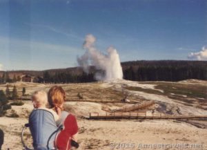 Watching Old Faithful in the Upper Geyser Basin, Yellowstone National Park, Wyoming