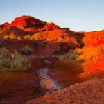 Crossing the creek at the trailhead for Butch Cassidy's Cabin near the Maze District of Canyonlands National Park, Utah